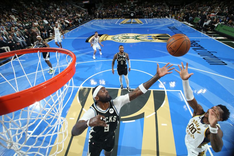 MILWAUKEE, WI - NOVEMBER 22:  Bobby Portis #9 of the Milwaukee Bucks and Bennedict Mathurin #00 of the Indiana Pacers go up for a rebound during the game between the Indiana Pacers and the Milwaukee Bucks during a Emirates NBA Cup on November 22, 2024 at Fiserv Forum Center in Milwaukee, Wisconsin. NOTE TO USER: User expressly acknowledges and agrees that, by downloading and or using this Photograph, user is consenting to the terms and conditions of the Getty Images License Agreement. Mandatory Copyright Notice: Copyright 2024 NBAE (Photo by Gary Dineen/NBAE via Getty Images).