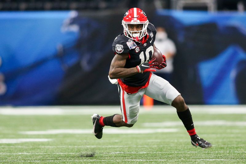 Jan 1, 2021; Atlanta, GA, USA; Georgia Bulldogs wide receiver Kearis Jackson (10) runs after a catch against the Cincinnati Bearcats in the first quarter of the Chick-fil-A Peach Bowl at Mercedes-Benz Stadium. Mandatory Credit: Brett Davis-USA TODAY Sports
