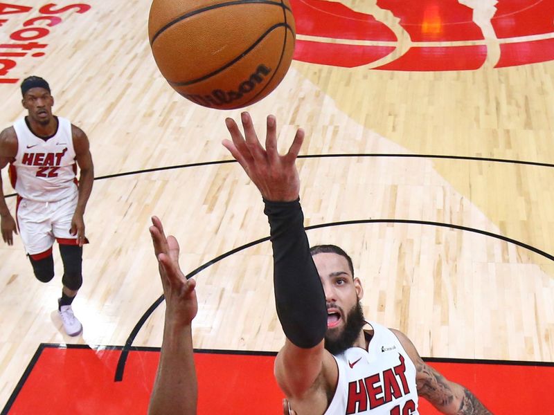 TORONTO, CANADA - JANUARY 17: Caleb Martin #16 of the Miami Heat drives to the basket during the game against the Toronto Raptors on January 17, 2024 at the Scotiabank Arena in Toronto, Ontario, Canada.  NOTE TO USER: User expressly acknowledges and agrees that, by downloading and or using this Photograph, user is consenting to the terms and conditions of the Getty Images License Agreement.  Mandatory Copyright Notice: Copyright 2024 NBAE (Photo by Vaughn Ridley/NBAE via Getty Images)