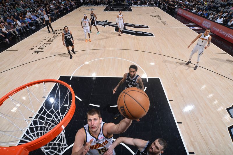 SAN ANTONIO, TX - APRIL 12:  Nikola Jokic #15 of the Denver Nuggets goes to the basket during the game on April 12, 2024 at the AT&T Center in San Antonio, Texas. NOTE TO USER: User expressly acknowledges and agrees that, by downloading and or using this photograph, user is consenting to the terms and conditions of the Getty Images License Agreement. Mandatory Copyright Notice: Copyright 2024 NBAE (Photos by Michael Gonzales/NBAE via Getty Images)