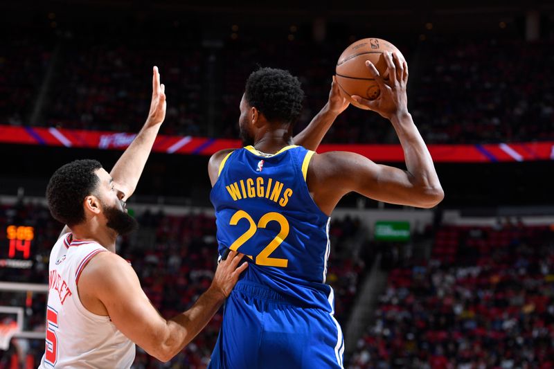 HOUSTON, TX - APRIL 4: Andrew Wiggins #22 of the Golden State Warriors handles the ball against Fred VanVleet #5 of the Houston Rockets during the game on April 4, 2024 at the Toyota Center in Houston, Texas. NOTE TO USER: User expressly acknowledges and agrees that, by downloading and or using this photograph, User is consenting to the terms and conditions of the Getty Images License Agreement. Mandatory Copyright Notice: Copyright 2024 NBAE (Photo by Logan Riely/NBAE via Getty Images)