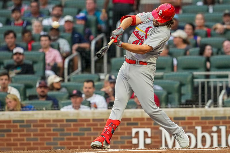 Sep 6, 2023; Cumberland, Georgia, USA; St. Louis Cardinals designated hitter Alec Burleson (41) singles before being thrown out trying to stretch to a double second baseman Nolan Gorman (16) against the Atlanta Braves during the first inning at Truist Park. Mandatory Credit: Dale Zanine-USA TODAY Sports