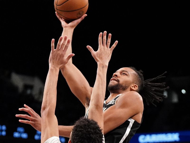 BROOKLYN, NY - January 6: Tosan Evbuomwan #12 of the Brooklyn Nets shoots the ball during the game against the Indiana Pacers on January 6, 2025 at Barclays Center in Brooklyn, New York. NOTE TO USER: User expressly acknowledges and agrees that, by downloading and or using this Photograph, user is consenting to the terms and conditions of the Getty Images License Agreement. Mandatory Copyright Notice: Copyright 2025 NBAE (Photo by Catalina Fragoso/NBAE via Getty Images)