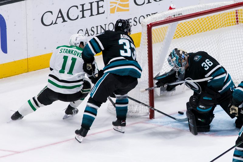 Mar 5, 2024; San Jose, California, USA; Dallas Stars center Logan Stankoven (11) scores on San Jose Sharks goaltender Kaapo Kahkonen (36) as defenseman Calen Addison (33) defends during the third period at SAP Center at San Jose. Mandatory Credit: John Hefti-USA TODAY Sports