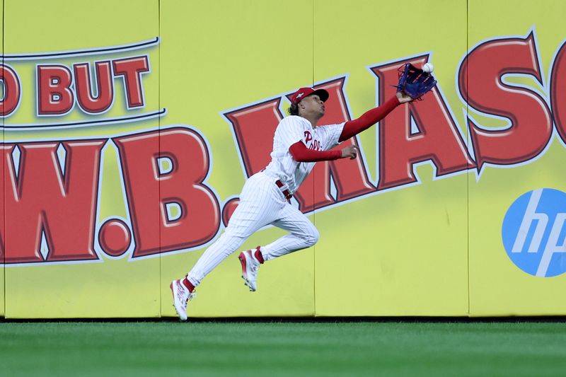 Oct 4, 2023; Philadelphia, Pennsylvania, USA; Philadelphia Phillies left fielder Cristian Pache (19) attempts to make a catch against the Miami Marlins during the third inning for game two of the Wildcard series for the 2023 MLB playoffs at Citizens Bank Park. Mandatory Credit: Bill Streicher-USA TODAY Sports