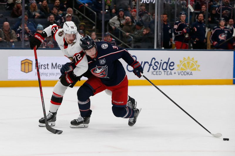 Jan 20, 2026; Columbus, Ohio, USA; Columbus Blue Jackets center Charlie Coyle (3) drags the puck as Ottawa Senators defenseman Thomas Chabot (72) defnds during the second period at Nationwide Arena. Mandatory Credit: Russell LaBounty-Imagn Images