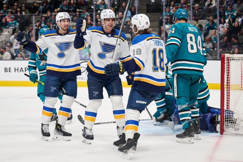 Apr 6, 2024; San Jose, California, USA; St. Louis Blues center Brayden Schenn (10) celebrates with center Jordan Kyrou (25) and center Robert Thomas (18) after scoring the game-tying goal against the San Jose Sharks during the third period at SAP Center at San Jose. Mandatory Credit: Robert Edwards-USA TODAY Sports