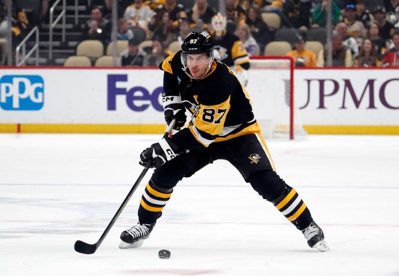 Mar 5, 2024; Pittsburgh, Pennsylvania, USA; Pittsburgh Penguins center Sidney Crosby (87) skates up ice with the puck against the Columbus Blue Jackets during the first period at PPG Paints Arena. Mandatory Credit: Charles LeClaire-USA TODAY Sports