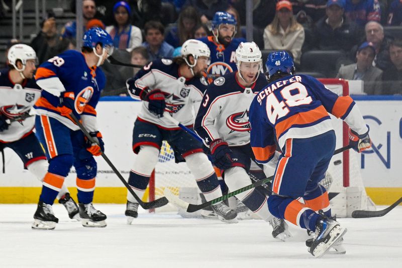 Nov 2, 2025; Elmont, New York, USA; New York Islanders defenseman Matthew Schaefer (48) shoots and scores a power play goal against the Columbus Blue Jackets  during the first period at UBS Arena. Mandatory Credit: Dennis Schneidler-Imagn Images