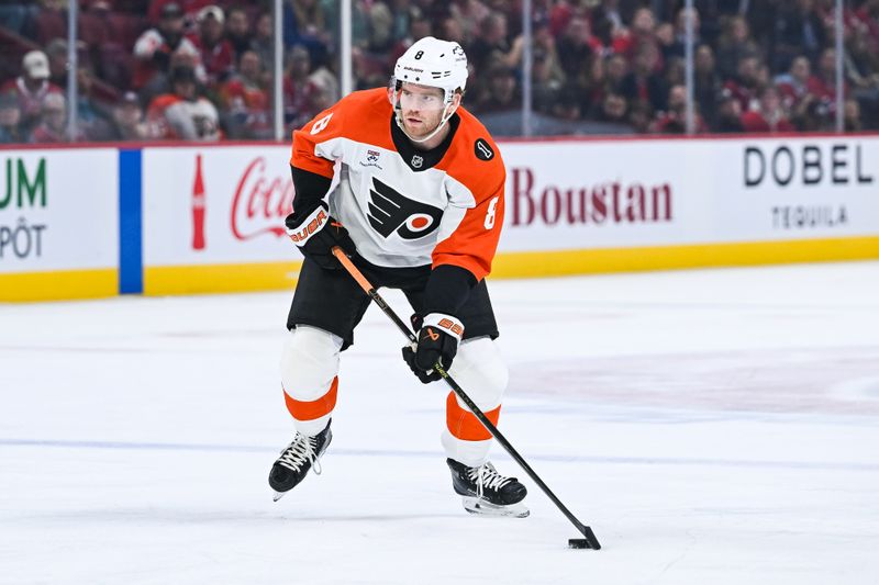 Nov 4, 2025; Montreal, Quebec, CAN; Philadelphia Flyers defenseman Cam York (8) plays the puck against the Montreal Canadiens during the first period at Bell Centre. Mandatory Credit: David Kirouac-Imagn Images