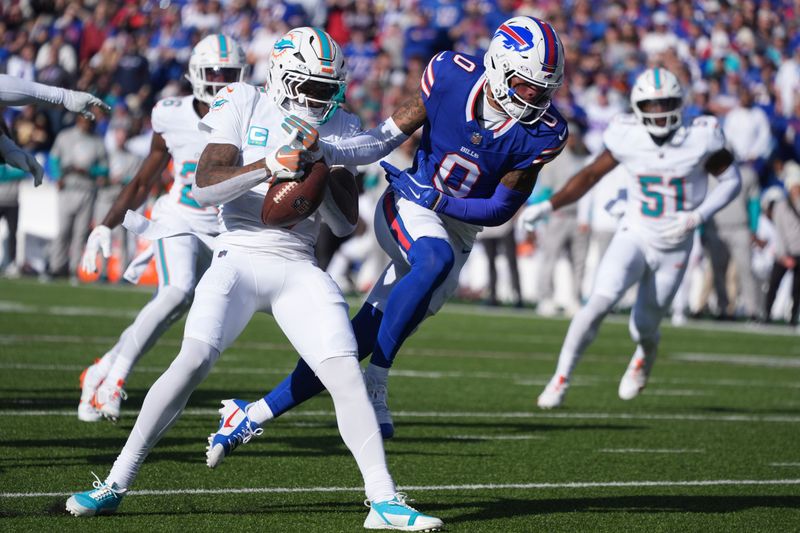 Miami Dolphins cornerback Jalen Ramsey, left, intercepts a pass intended for Buffalo Bills wide receiver Keon Coleman (0) during the first half of an NFL football game Sunday, Nov. 3, 2024, in Orchard Park, N.Y. (AP Photo/Gene Puskar)