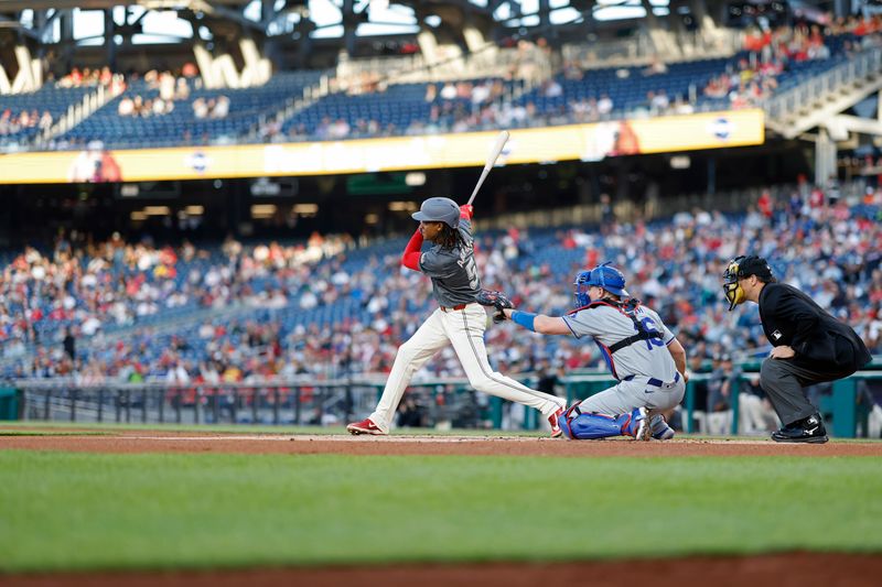 Apr 23, 2024; Washington, District of Columbia, USA; Washington Nationals shortstop CJ Abrams (5) singles against the Los Angeles Dodgers during the first inning at Nationals Park. Mandatory Credit: Geoff Burke-USA TODAY Sports