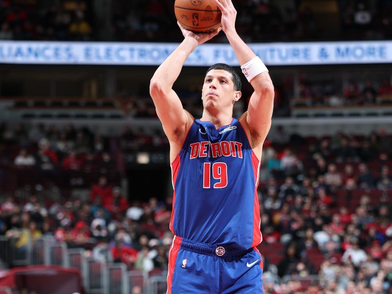 CHICAGO, IL - FEBRUARY 12:  Simone Fontecchio #19 of the Detroit Pistons shoots a free throw during the game against the Chicago Bulls on February 12, 2025 at United Center in Chicago, Illinois. NOTE TO USER: User expressly acknowledges and agrees that, by downloading and or using this photograph, User is consenting to the terms and conditions of the Getty Images License Agreement. Mandatory Copyright Notice: Copyright 2025 NBAE (Photo by Jeff Haynes/NBAE via Getty Images)