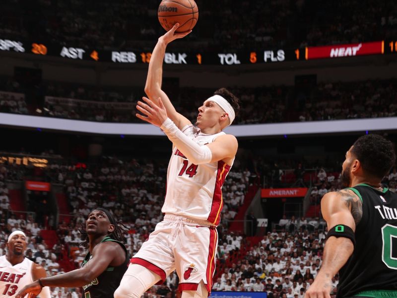 MIAMI, FL - APRIL 27: Tyler Herro #14 of the Miami Heat shoots the ball during the game against the Boston Celtics during Round 1 Game 3 of the 2024 NBA Playoffs on April 27, 2024 at Kaseya Center in Miami, Florida. NOTE TO USER: User expressly acknowledges and agrees that, by downloading and or using this Photograph, user is consenting to the terms and conditions of the Getty Images License Agreement. Mandatory Copyright Notice: Copyright 2024 NBAE (Photo by Issac Baldizon/NBAE via Getty Images)