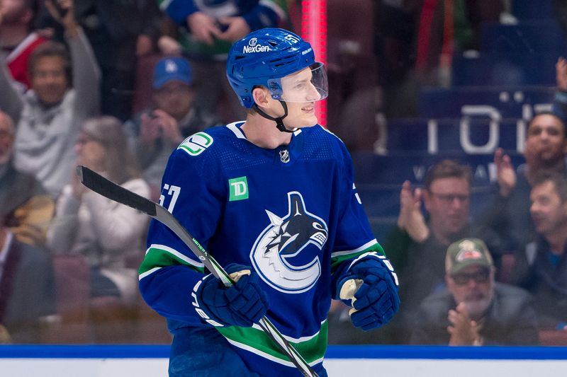 Mar 21, 2024; Vancouver, British Columbia, CAN; Vancouver Canucks defenseman Tyler Myers (57) celebrates a goal scored by forward Nils Aman (88) against the Montreal Canadiens in the third period at Rogers Arena. Vancouver won 4 -1. Mandatory Credit: Bob Frid-USA TODAY Sports