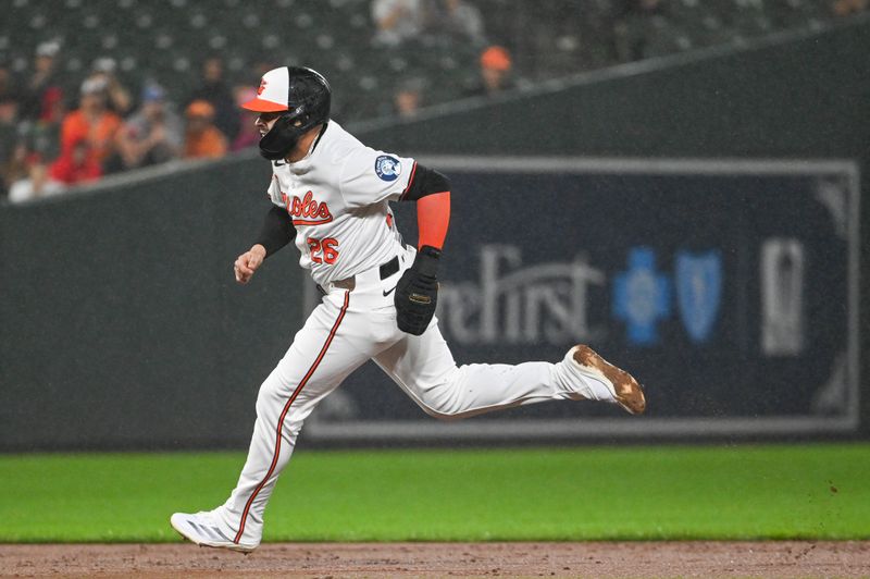 Sep 18, 2024; Baltimore, Maryland, USA;  Baltimore Orioles third base Emmanuel Rivera (26) runs to third base during the third inning against the San Francisco Giants at Oriole Park at Camden Yards. Mandatory Credit: Tommy Gilligan-Imagn Images