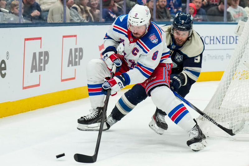 Nov 15, 2025; Columbus, Ohio, USA;  New York Rangers center J.T. Miller (8) skates with the puck against Columbus Blue Jackets defenseman Ivan Provorov (9) in the third period at Nationwide Arena. Mandatory Credit: Aaron Doster-Imagn Images