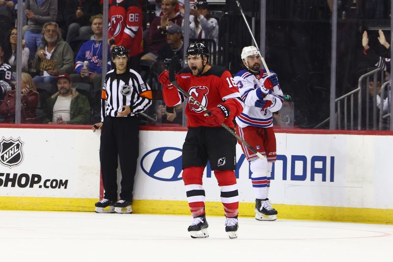 Sep 30, 2024; Newark, New Jersey, USA; New Jersey Devils right wing Nathan Legare (16) celebrates his goal against the New York Rangers during the first period at Prudential Center. Mandatory Credit: Ed Mulholland-Imagn Images