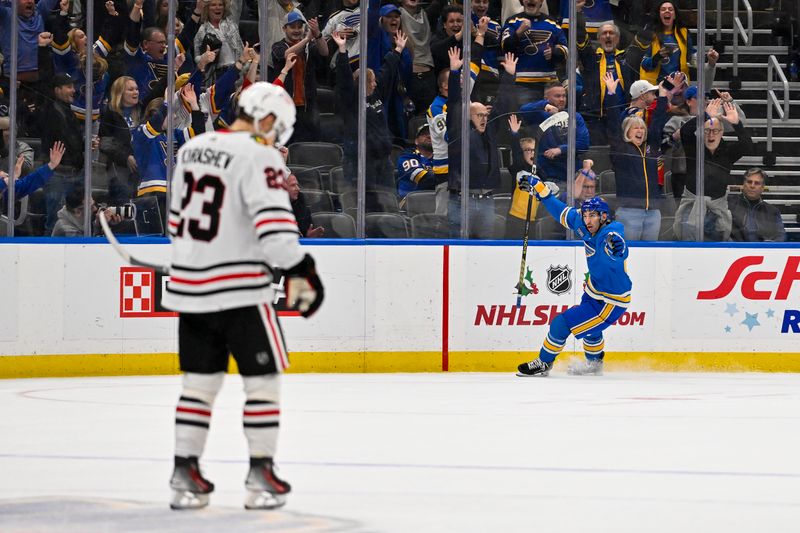 Dec 23, 2023; St. Louis, Missouri, USA;  St. Louis Blues center Jordan Kyrou (25) reacts after scoring against the Chicago Blackhawks during the third period at Enterprise Center. Mandatory Credit: Jeff Curry-USA TODAY Sports