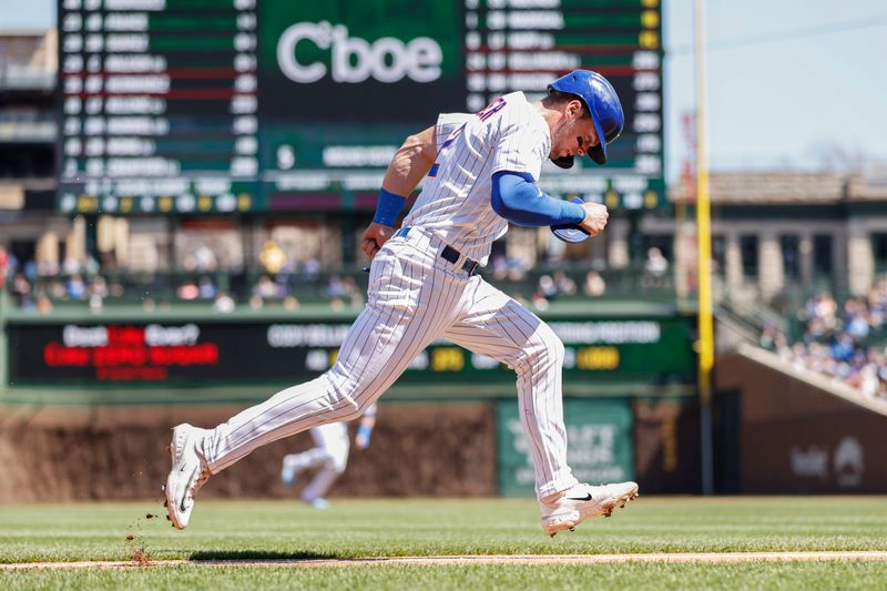 Apr 12, 2023; Chicago, Illinois, USA; Chicago Cubs second baseman Nico Hoerner (2) runs to score against the Seattle Mariners during the first inning at Wrigley Field. Mandatory Credit: Kamil Krzaczynski-USA TODAY Sports