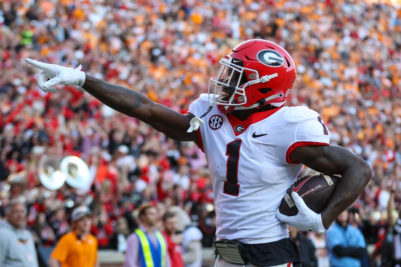 Nov 18, 2023; Knoxville, Tennessee, USA; Georgia Bulldogs wide receiver Marcus Rosemy-Jacksaint (1) reacts after catching a touchdown pass against the Tennessee Volunteers during the first half at Neyland Stadium. Mandatory Credit: Randy Sartin-USA TODAY Sports