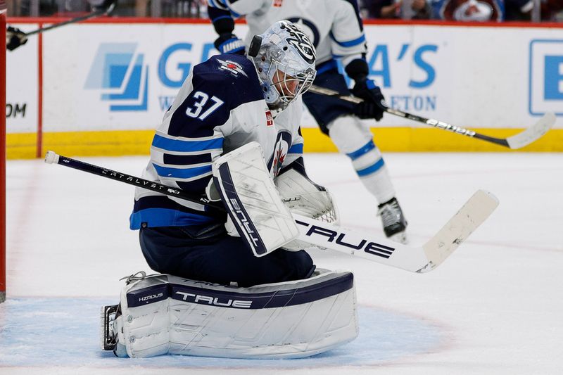 Apr 13, 2024; Denver, Colorado, USA; Winnipeg Jets goaltender Connor Hellebuyck (37) makes a save in the second period against the Colorado Avalanche at Ball Arena. Mandatory Credit: Isaiah J. Downing-USA TODAY Sports