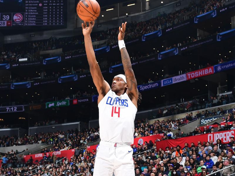 LOS ANGELES, CA - MARCH 17: Terance Mann #14 of the LA Clippers shoots a three point basket against the Atlanta Hawks on March 17, 2024 at Crypto.Com Arena in Los Angeles, California. NOTE TO USER: User expressly acknowledges and agrees that, by downloading and/or using this Photograph, user is consenting to the terms and conditions of the Getty Images License Agreement. Mandatory Copyright Notice: Copyright 2024 NBAE (Photo by Adam Pantozzi/NBAE via Getty Images)