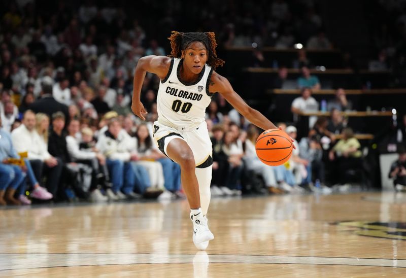 Jan 19, 2024; Boulder, Colorado, USA; Colorado Buffaloes guard Jaylyn Sherrod (00) drives to the net in the first quarter against the UCLA Bruins at the CU Events Center. Mandatory Credit: Ron Chenoy-USA TODAY Sports
\v11