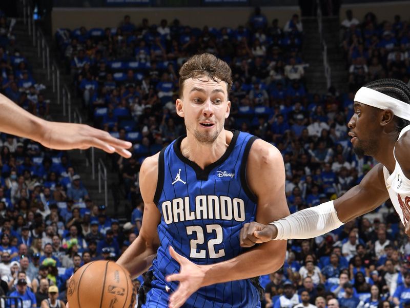 ORLANDO, FL - APRIL 27: Franz Wagner #22 of the Orlando Magic dribbles the ball during the game against the Cleveland Cavaliers during Round 1 Game 4 of the 2024 NBA Playoffs on April 27, 2024 at the Kia Center in Orlando, Florida. NOTE TO USER: User expressly acknowledges and agrees that, by downloading and or using this photograph, User is consenting to the terms and conditions of the Getty Images License Agreement. Mandatory Copyright Notice: Copyright 2024 NBAE (Photo by Fernando Medina/NBAE via Getty Images)