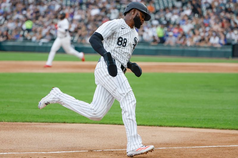 Jun 25, 2024; Chicago, Illinois, USA; Chicago White Sox outfielder Luis Robert Jr. (88) runs to score against the Los Angeles Dodgers during the first inning at Guaranteed Rate Field. Mandatory Credit: Kamil Krzaczynski-USA TODAY Sports