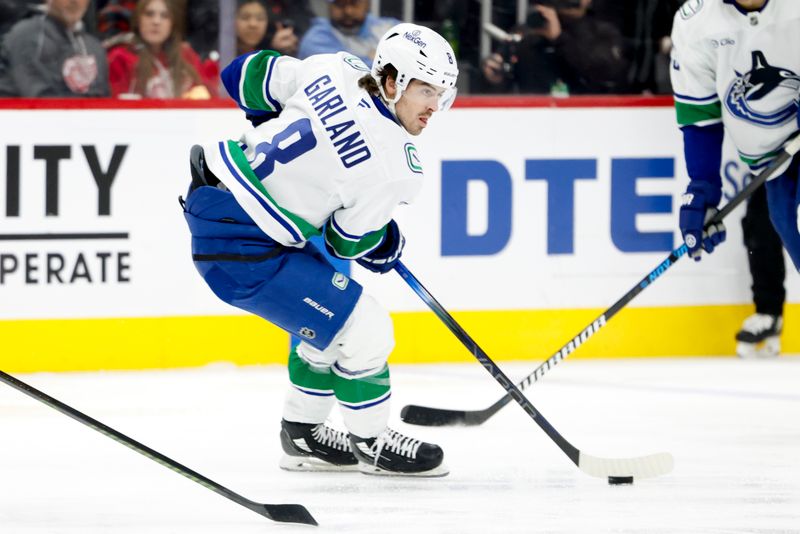 Dec 1, 2024; Detroit, Michigan, USA;  Vancouver Canucks right wing Conor Garland (8) skates with the puck in the first period against the Detroit Red Wings at Little Caesars Arena. Mandatory Credit: Rick Osentoski-Imagn Images