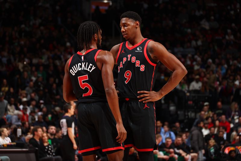 TORONTO, CANADA - JANUARY 15:  Immanuel Quickley #5 and RJ Barrett #9 of the Toronto Raptors talk during the game against the Boston Celtics on January 15, 2024 at the Scotiabank Arena in Toronto, Ontario, Canada.  NOTE TO USER: User expressly acknowledges and agrees that, by downloading and or using this Photograph, user is consenting to the terms and conditions of the Getty Images License Agreement.  Mandatory Copyright Notice: Copyright 2024 NBAE (Photo by Vaughn Ridley/NBAE via Getty Images)