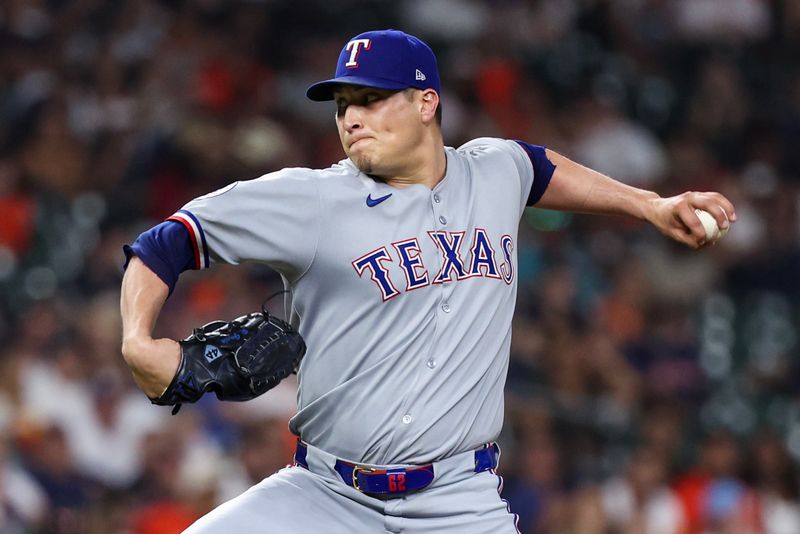 Sep 17, 2025; Houston, Texas, USA : Texas Rangers relief pitcher Robert Garcia (62) pitches against the Houston Astros in the sixth inning at Daikin Park. Mandatory Credit: Thomas Shea-Imagn Images