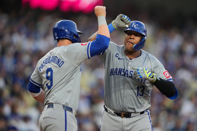 Jun 14, 2024; Los Angeles, California, USA; Kansas City Royals catcher Salvador Perez (13) celebrates with first baseman Vinnie Pasquantino (9) after hitting a three-run home run in the second inning against the Los Angeles Dodgers at Dodger Stadium. Mandatory Credit: Kirby Lee-USA TODAY Sports