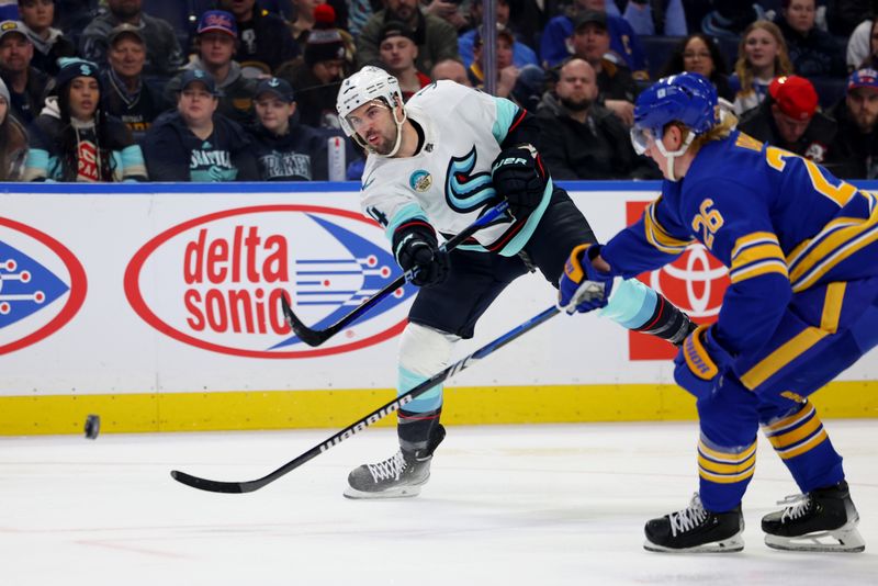 Jan 9, 2024; Buffalo, New York, USA;  Buffalo Sabres defenseman Rasmus Dahlin (26) looks to block a shot by Seattle Kraken defenseman Justin Schultz (4) during the first period at KeyBank Center. Mandatory Credit: Timothy T. Ludwig-USA TODAY Sports