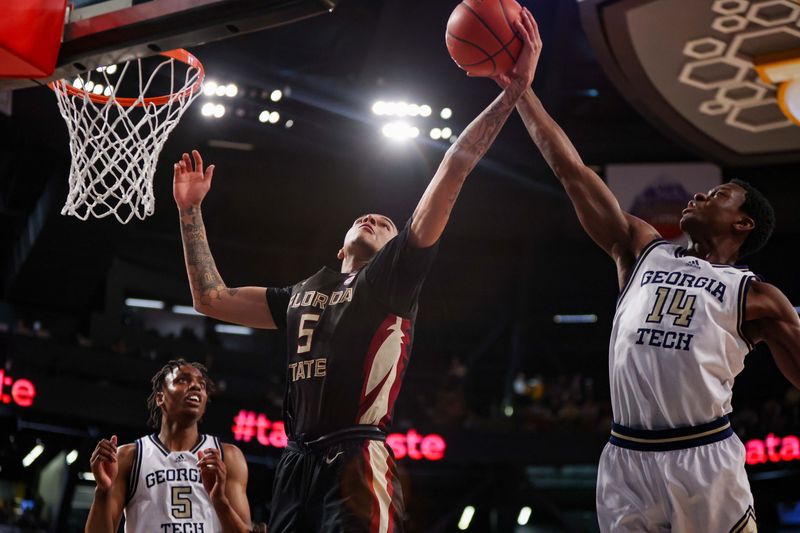 Mar 2, 2024; Atlanta, Georgia, USA; Florida State Seminoles forward De'Ante Green (5) grabs a rebound past Georgia Tech Yellow Jackets guard Kowacie Reeves Jr. (14) in the first half at McCamish Pavilion. Mandatory Credit: Brett Davis-USA TODAY Sports