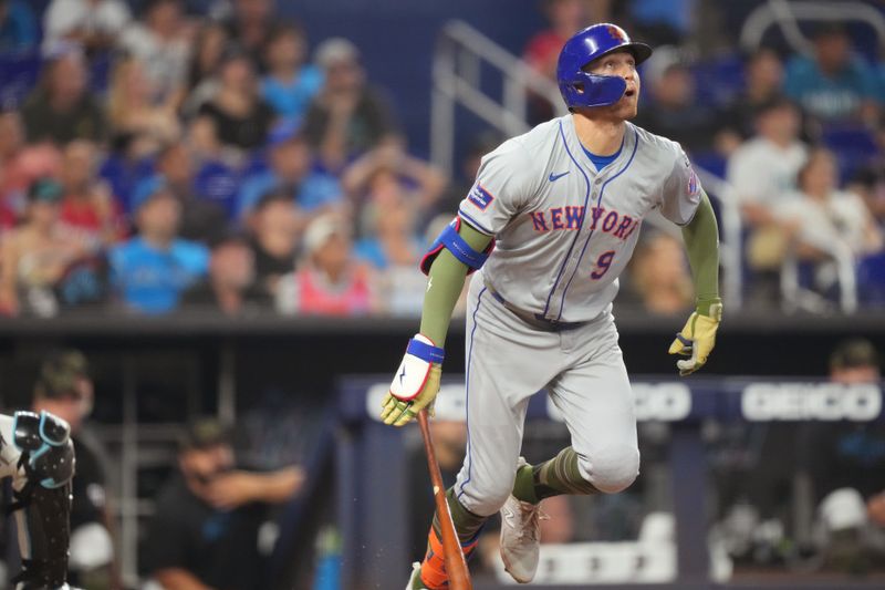 May 19, 2024; Miami, Florida, USA;  New York Mets designated hitter Brandon Nimmo (9) watches his home run in the ninth inning against the Miami Marlins at loanDepot Park. Mandatory Credit: Jim Rassol-USA TODAY Sports