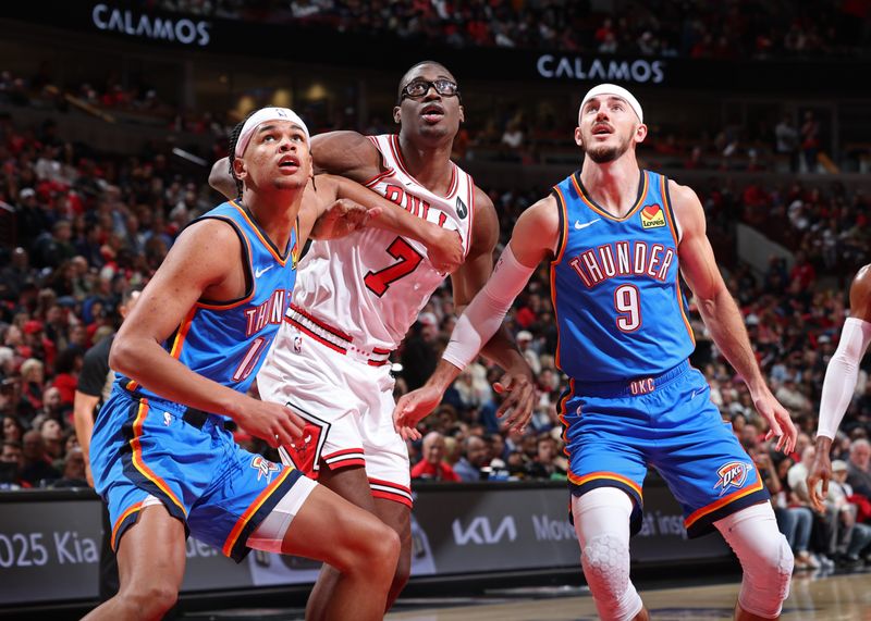 CHICAGO, IL - OCTOBER 26: Ousmane Dieng #13 and Alex Caruso #9 of the Oklahoma City Thunder box out during the game against the Chicago Bulls on October 26, 2024 at United Center in Chicago, Illinois. NOTE TO USER: User expressly acknowledges and agrees that, by downloading and or using this photograph, User is consenting to the terms and conditions of the Getty Images License Agreement. Mandatory Copyright Notice: Copyright 2024 NBAE (Photo by Jeff Haynes/NBAE via Getty Images)