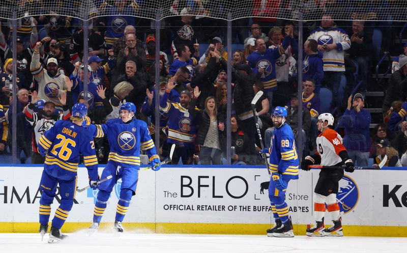 Apr 5, 2024; Buffalo, New York, USA;  Buffalo Sabres center Tage Thompson (72) celebrates his goal with defenseman Rasmus Dahlin (26) during the first period against the Philadelphia Flyers at KeyBank Center. Mandatory Credit: Timothy T. Ludwig-USA TODAY Sports