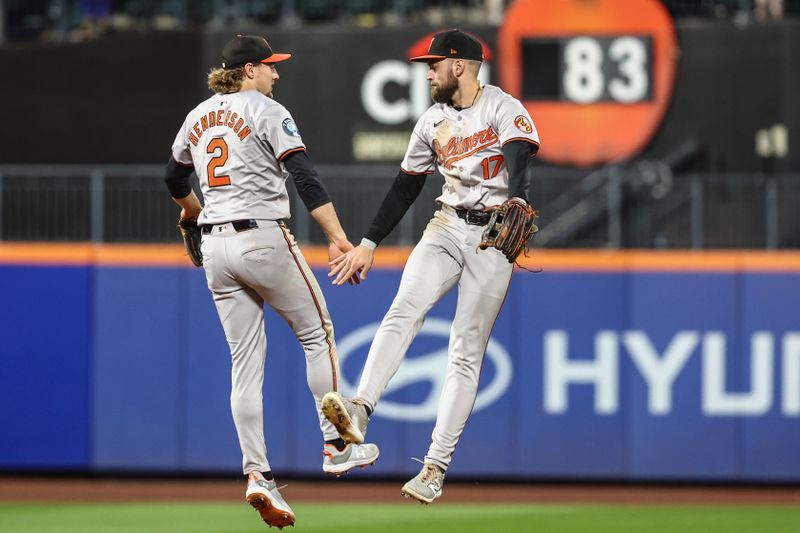 Aug 20, 2024; New York City, New York, USA;  Baltimore Orioles shortstop Gunnar Henderson (2) and center fielder Colton Cowser (17) celebrate after defeating the New York Mets 9-5 at Citi Field. Mandatory Credit: Wendell Cruz-USA TODAY Sports