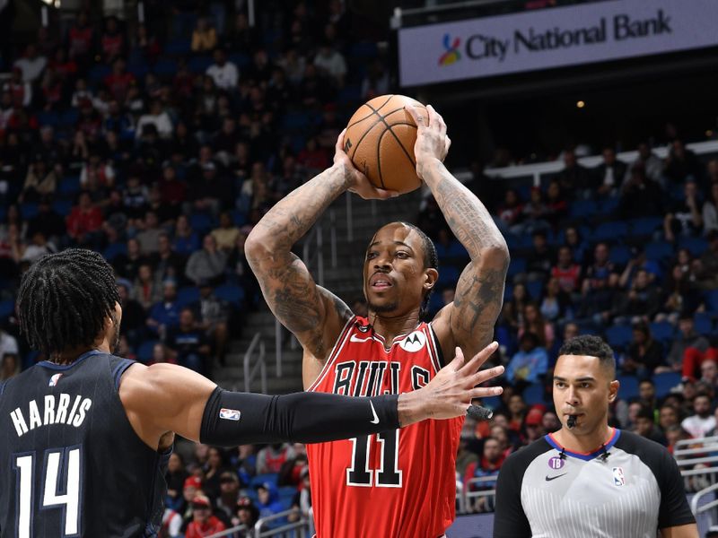 ORLANDO, FL - JANUARY 28: DeMar DeRozan #11 of the Chicago Bulls looks to pass the ball during the game against the Orlando Magic on January 28, 2023 at Amway Center in Orlando, Florida. NOTE TO USER: User expressly acknowledges and agrees that, by downloading and or using this photograph, User is consenting to the terms and conditions of the Getty Images License Agreement. Mandatory Copyright Notice: Copyright 2023 NBAE (Photo by Fernando Medina/NBAE via Getty Images)