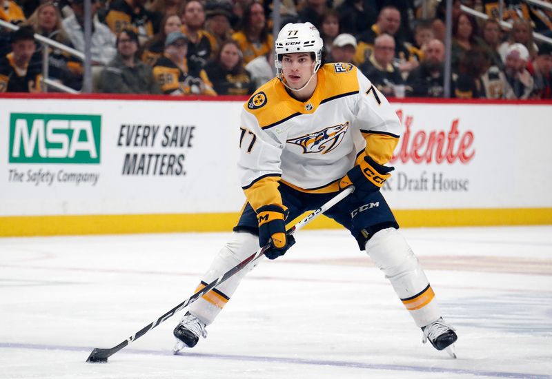 Apr 15, 2024; Pittsburgh, Pennsylvania, USA;  Nashville Predators right wing Luke Evangelista (77) skates up ice with the puck against the Pittsburgh Penguins during the second period at PPG Paints Arena. Mandatory Credit: Charles LeClaire-USA TODAY Sports