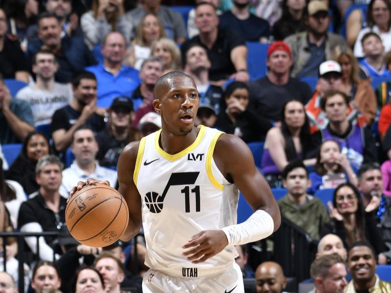 ORLANDO, FL - FEBRUARY 29: Kris Dunn #11 of the Utah Jazz handles the ball during the game against the Orlando Magic on February 29, 2024 at Amway Center in Orlando, Florida. NOTE TO USER: User expressly acknowledges and agrees that, by downloading and or using this photograph, User is consenting to the terms and conditions of the Getty Images License Agreement. Mandatory Copyright Notice: Copyright 2024 NBAE (Photo by Fernando Medina/NBAE via Getty Images)