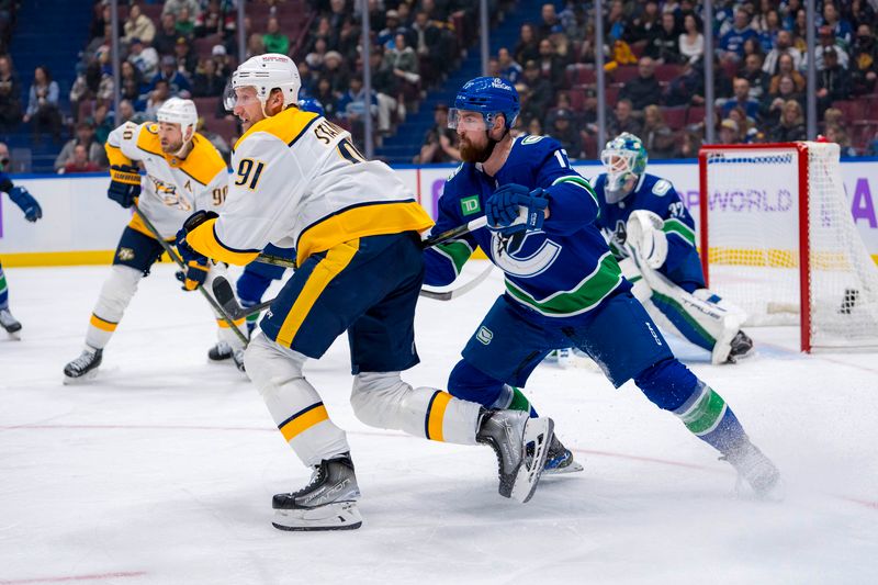 Nov 17, 2024; Vancouver, British Columbia, CAN; Vancouver Canucks defenseman Filip Hronek (17) battles with Nashville Predators forward Steven Stamkos (91) during the second period at Rogers Arena. Mandatory Credit: Bob Frid-Imagn Images