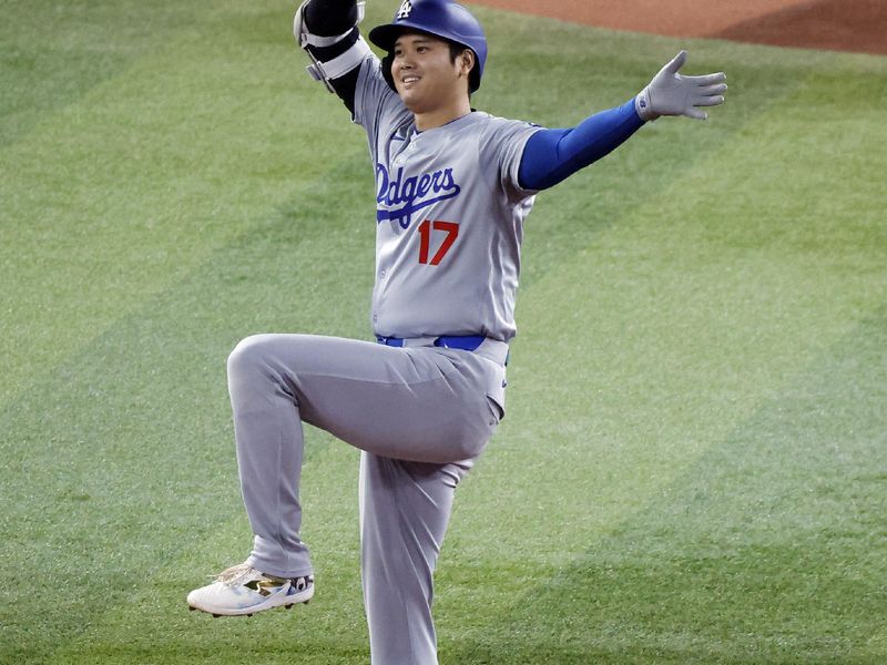 Sep 19, 2024; Miami, Florida, USA;   Los Angeles Dodgers designated hitter Shohei Ohtani (17) reacts after his double against the Miami Marlins during the first inning at loanDepot Park. Mandatory Credit: Rhona Wise-Imagn Images