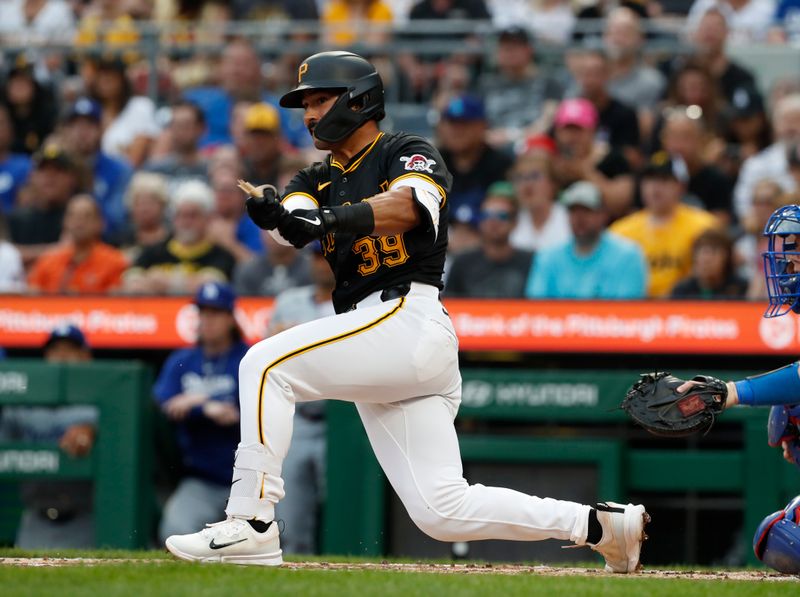 Jun 5, 2024; Pittsburgh, Pennsylvania, USA;  Pittsburgh Pirates shortstop Nick Gonzales (39) hits a two run double against the Los Angeles Dodgers during the second inning at PNC Park. Mandatory Credit: Charles LeClaire-USA TODAY Sports