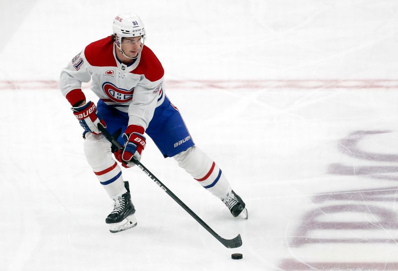 Jan 27, 2024; Pittsburgh, Pennsylvania, USA;  Montreal Canadiens center Sean Monahan (91) skates with the puck against the Pittsburgh Penguins during the first period at PPG Paints Arena. Mandatory Credit: Charles LeClaire-USA TODAY Sports