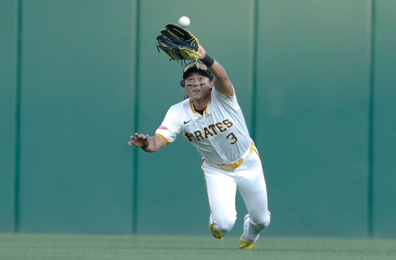 Aug 26, 2024; Pittsburgh, Pennsylvania, USA;  Pittsburgh Pirates center fielder Ji Hwan Bae (3) can not catch a ball hit for a double by Chicago Cubs second baseman Nico Hoerner (not pictured) during the second inning at PNC Park. Mandatory Credit: Charles LeClaire-USA TODAY Sports