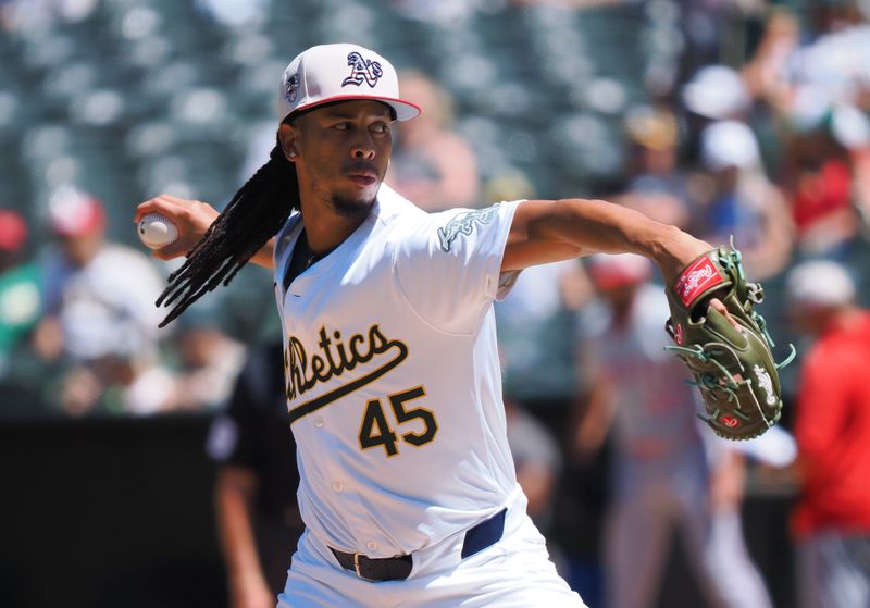 Jul 4, 2024; Oakland, California, USA; Oakland Athletics relief pitcher Osvaldo Bido (45) pitches the ball against the Los Angeles Angels during the sixth inning at Oakland-Alameda County Coliseum. Mandatory Credit: Kelley L Cox-USA TODAY Sports