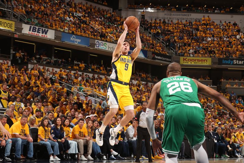 INDIANAPOLIS, IN - MAY 27: T.J. McConnell #9 of the Indiana Pacers drives to the basket during the game against the Boston Celtics during Game 4 of the Eastern Conference Finals of the 2024 NBA Playoffs on May 27, 2024 at Gainbridge Fieldhouse in Indianapolis, Indiana. NOTE TO USER: User expressly acknowledges and agrees that, by downloading and or using this Photograph, user is consenting to the terms and conditions of the Getty Images License Agreement. Mandatory Copyright Notice: Copyright 2024 NBAE (Photo by Nathaniel S. Butler/NBAE via Getty Images)